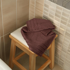Tens Towels-pack-display-brown-towels ready for organized storage in bathroom.