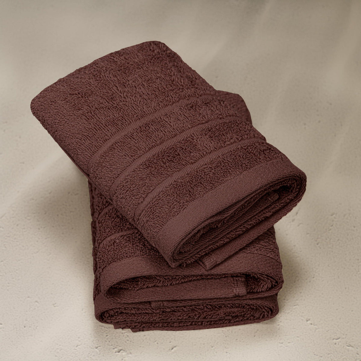 Tens Towels machine-washable-brown-hand-towels indicates easy care.