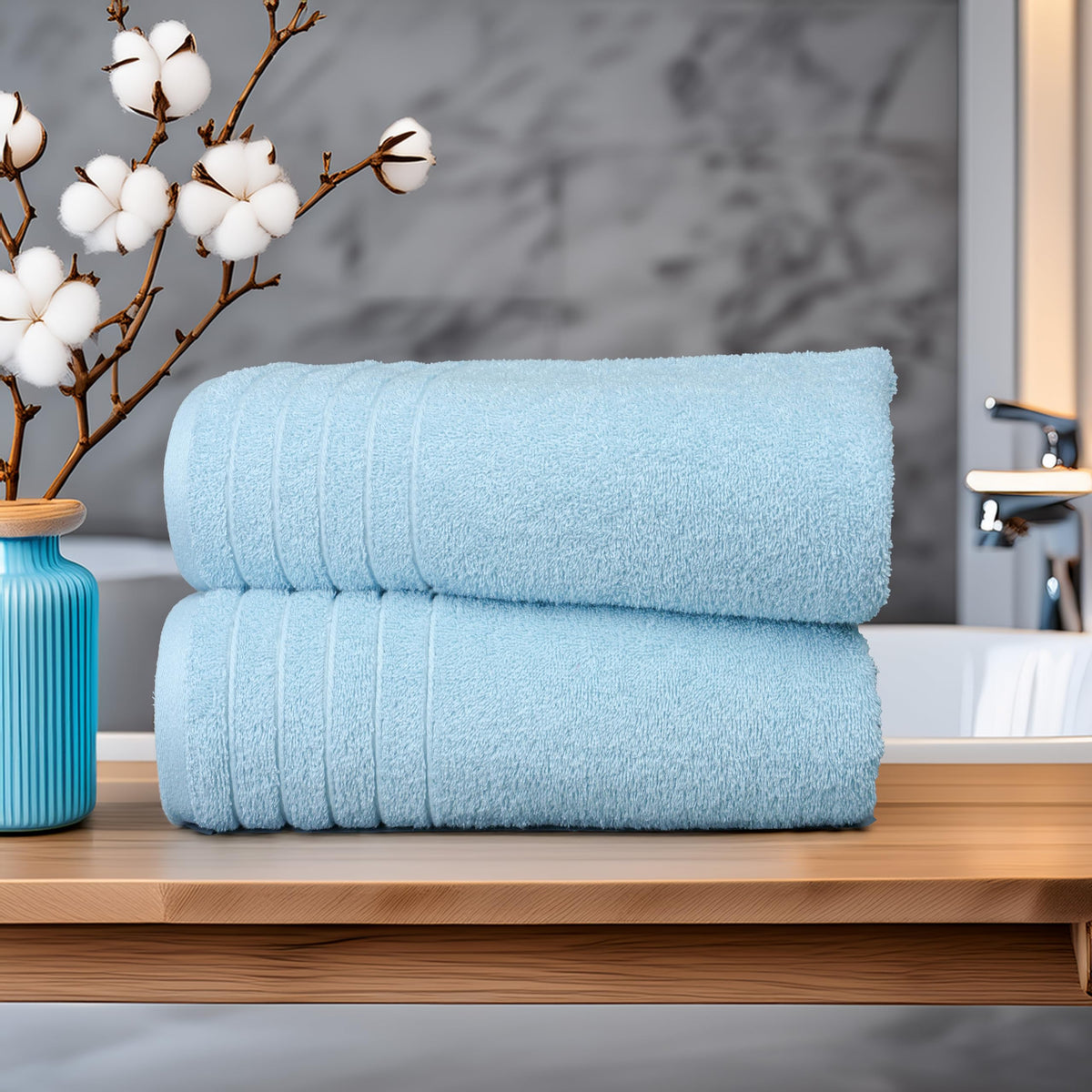 Tens Towels oversized bath towels folded for easy wrapping and lounging.