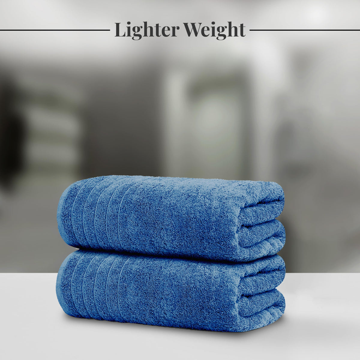 Tens Towels pack two extra-large blue bath sheets ready for shared use.