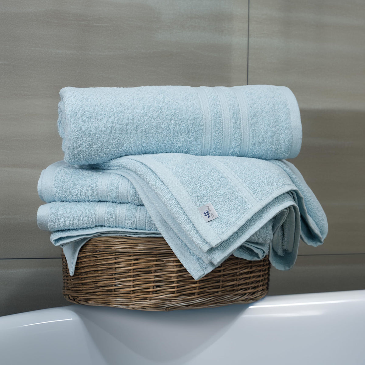 Tens Towels folded stack displays four-piece towel set ready for use