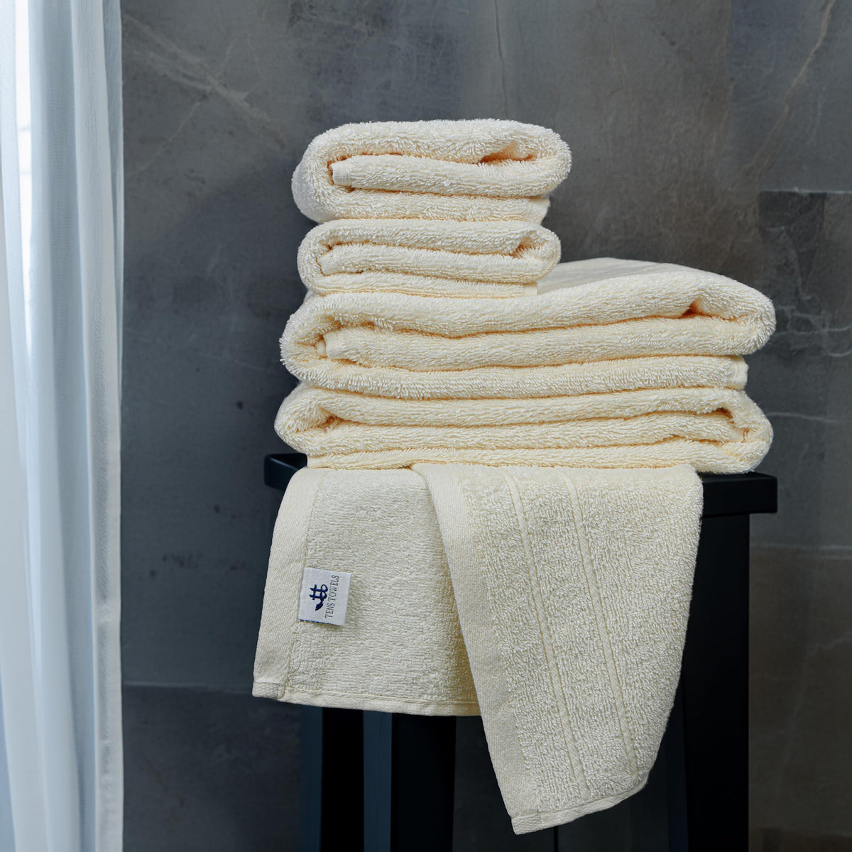 Tens Towels washcloths in cream deliver gentle exfoliation and fast absorption.