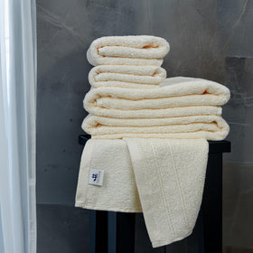 Tens Towels washcloths in cream deliver gentle exfoliation and fast absorption.