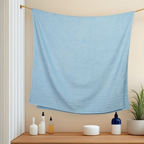 Tens Towels sky blue bath towels folded display soft cotton texture.