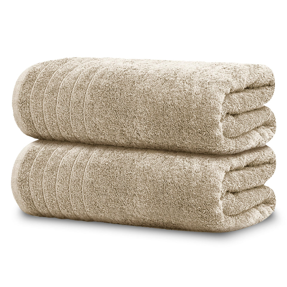 Tens Towels two oversized bath sheets laid flat, showcasing softness and size.