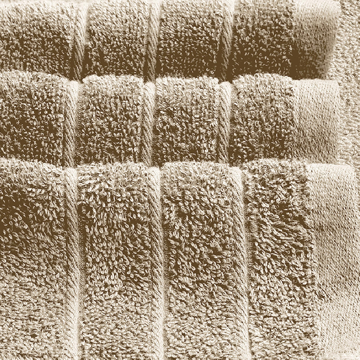 Two-pack of Tens Towels resting on a bathroom shelf for easy display.