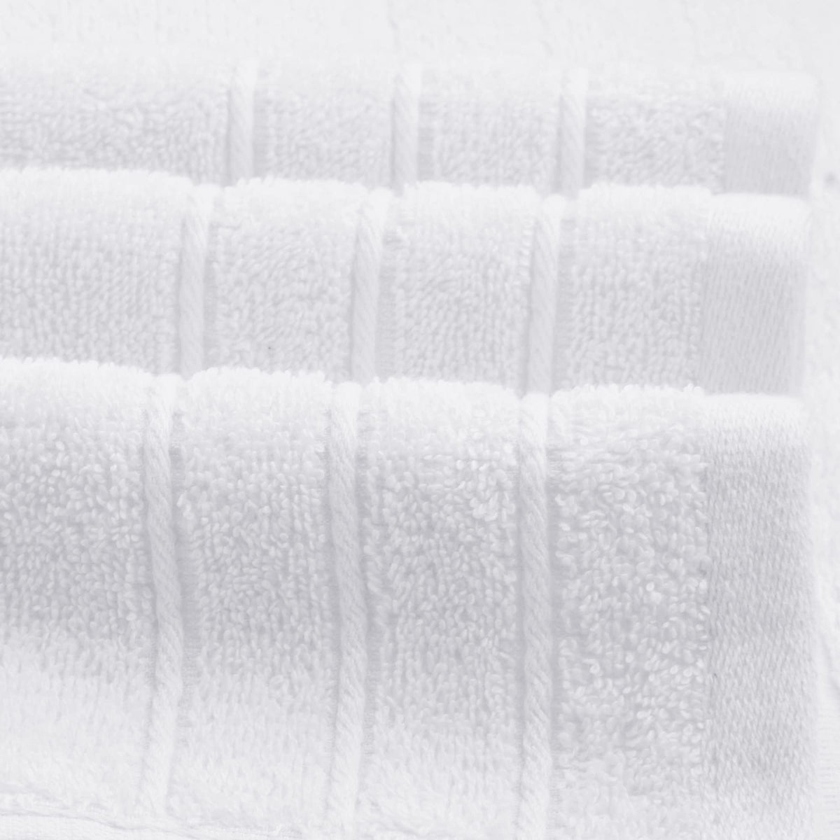 Tens Towels pristine white fabric, ideal for bathroom display.