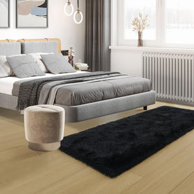 Tepook bedside rug in bedroom adds warmth and quiet ambiance