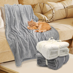 Tewloss folded blanket display showing compact storage and quick warmth