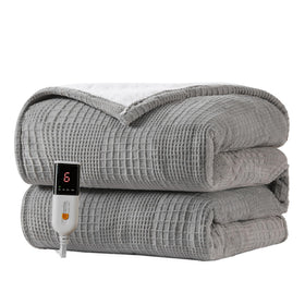 Texciting heated blanket throw on a bed with plush warmth