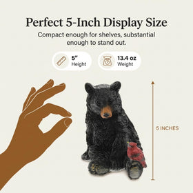 Close-up of resin texture showing lifelike bear and cardinal details for realistic decor.