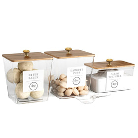 The Concept Boutique Paris three-pack laundry containers with clear pods for organized laundry.