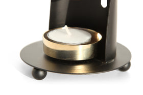 The Jerusalem Gift Shop incense burner rests on wooden base with felt for surface protection.