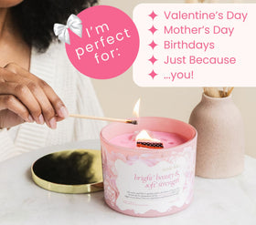 The Mindful Collective pink candle with wood wick and gentle crackle for meditation.