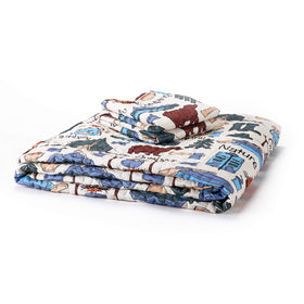 The Lakeside campsite quilt on a bed adds color for home or RV styling.