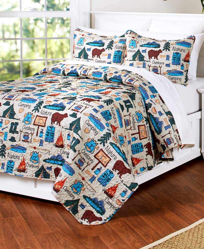 The Lakeside Collection campsite quilt pattern close-up highlighting tents and campfire colors for cozy cabin decor.
