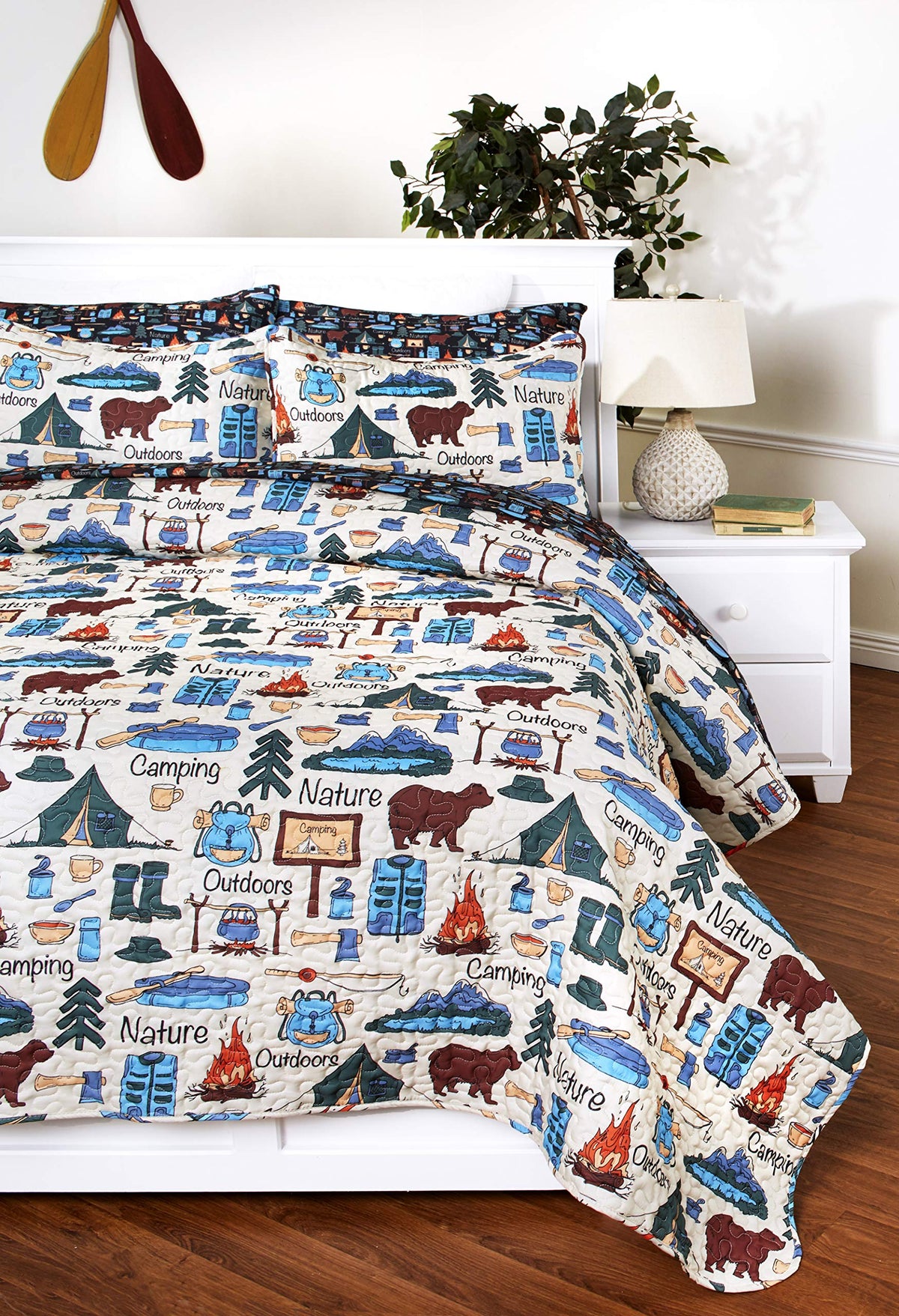 The Lakeside Collection quilt shams pairing enhances camp-inspired bedrooms with cheerful durable bedding.