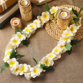 Close-up of lifelike white plumeria petals from Thiccywoov lei