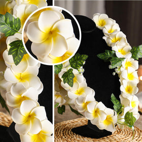 Lei used as a photo prop at a tropical wedding or luau