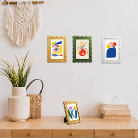 THKRLOF yellow wavy-edge frame mounted on wall in a bright space