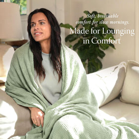 All-season use of Threadmill blanket shown on a sofa for versatile living
