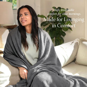 Threadmill cotton blanket on a couch for cozy lounging