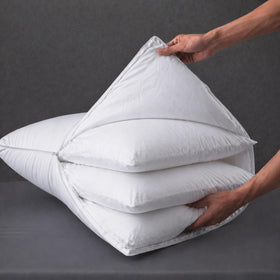 Three Geese adjustable-layer pillow assembly close-up showing removable inner inserts for personalized support.