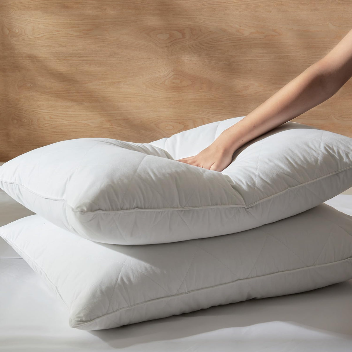 Three Geese pillow cotton shell close-up emphasizing smooth, breathable 600-thread-count fabric.