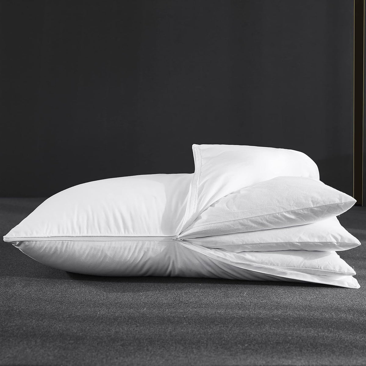 Three Geese pillow inner layers stacked to illustrate customizable height and comfort.