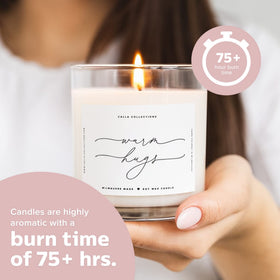 Close-up of ThreeKin Warm Hugs candle flame and glow
