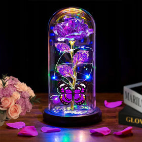 Thrjia light-up rose in a glass dome emits a soft romantic glow.