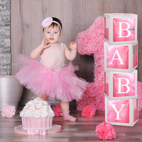 Thyle gender reveal party setup using balloon boxes and letters