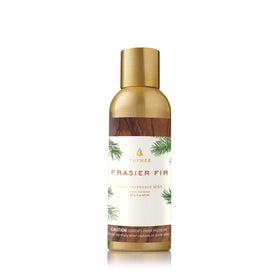 Thymes Frasier Fir mist bottle pour, delivering a fresh forest atmosphere