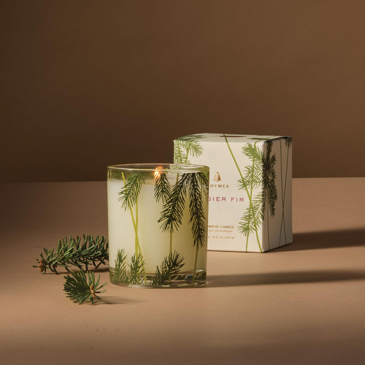Thymes Frasier Fir candle highlights Siberian fir needles for a refreshing living space.