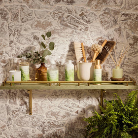 Thymes Home Fragrance Mist near sofa creating inviting living room ambience