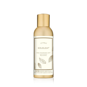 Thymes Home Fragrance Mist in Goldleaf bottle enhances room ambiance with lasting scent.