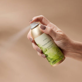 Thymes Home Fragrance Mist spray in use to refresh a car interior