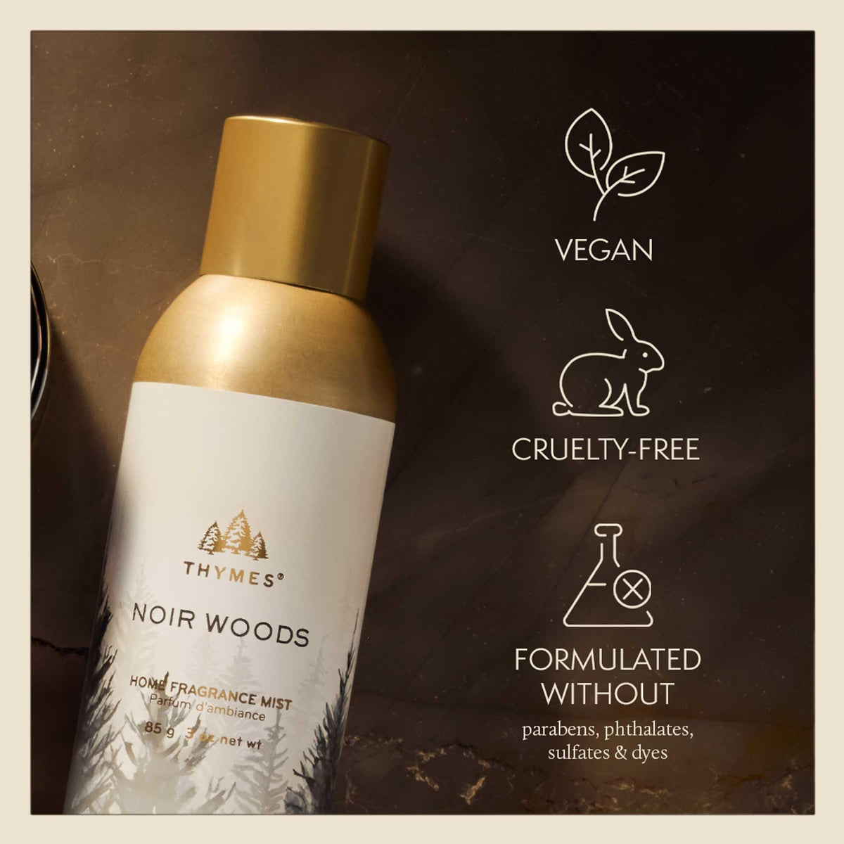 Thymes Noir Woods mist with golden glow, enhances shelf styling.
