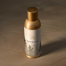 Thymes Noir Woods mist spray action, quick refresh for living spaces.