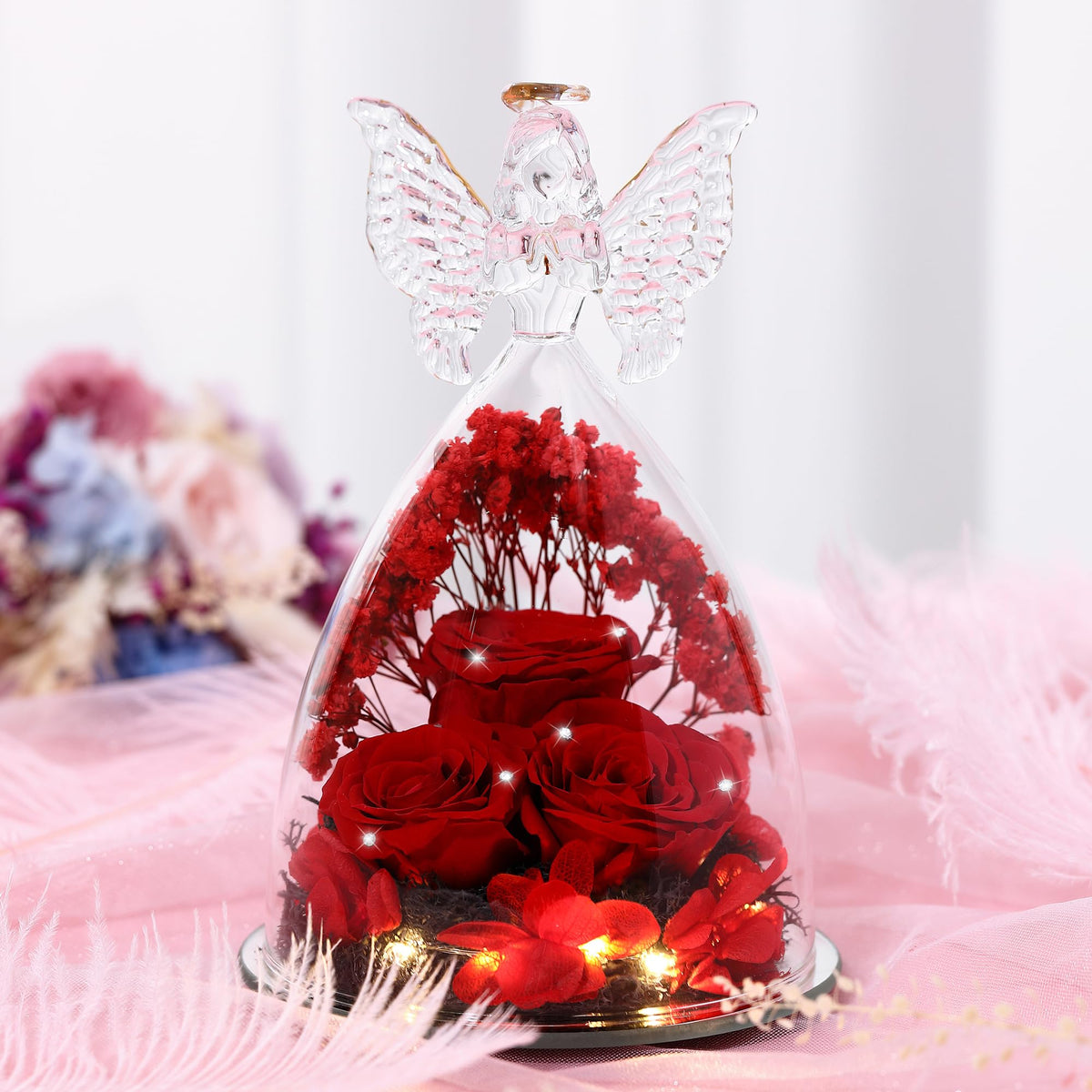 Crystal red Tiaronics rose angel adds a romantic centerpiece look.