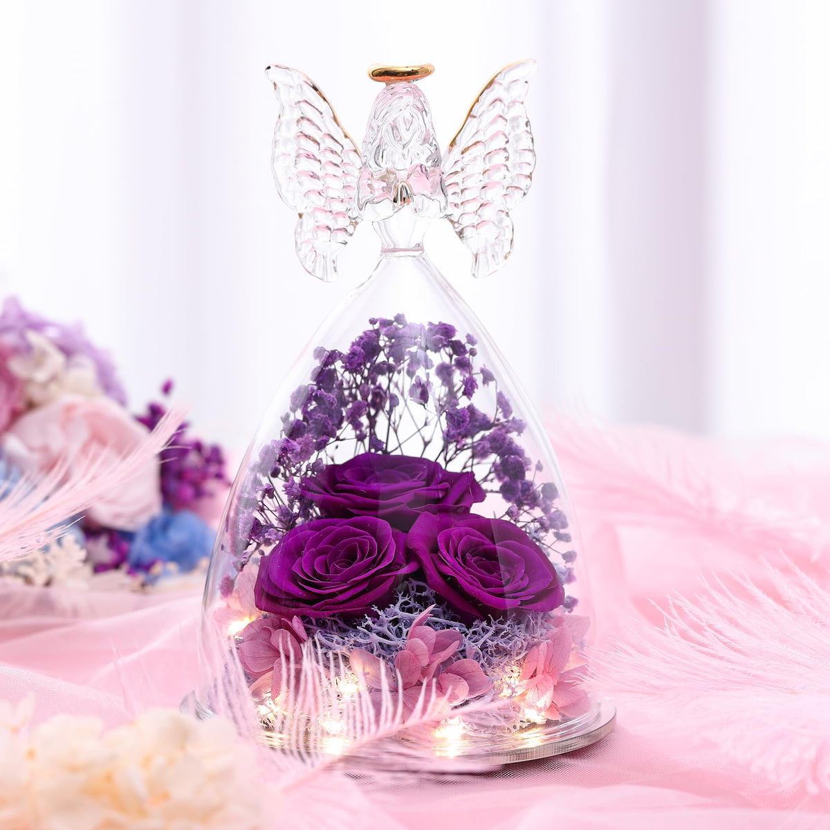Tiaronics preserved rose bouquet inside angel, lasting bloom.
