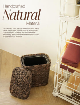 Tidita wicker trash can with black iron frame for durability.