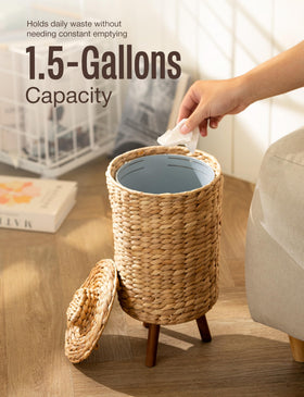 Tidita wicker trash can with wooden legs shown from the side for easy placement.