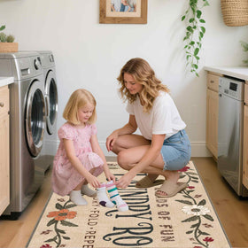 TIKIRUGI rug placed in front of a standard washer and dryer for space-saving use.