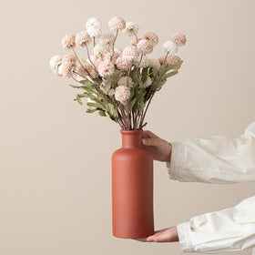 TINCTOTNIC mantel display with three vases creates balanced visual interest.