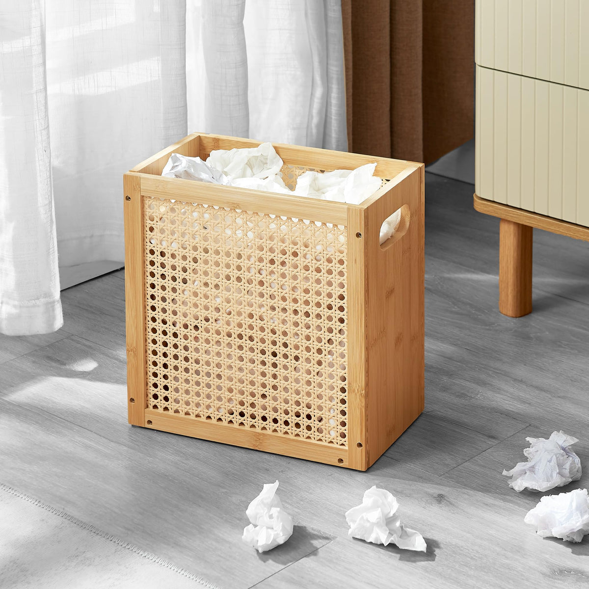 TIOPGHAD small-wicker-waste-basket showcases bamboo frame and sturdy handles for easy relocation