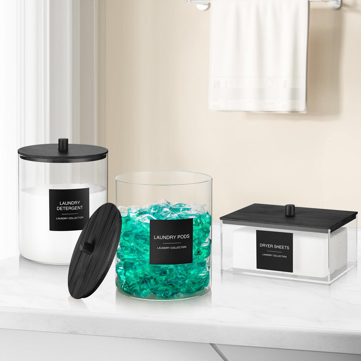 TIPGO storage jars set in a tidy laundry workspace.
