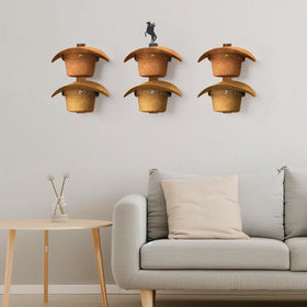 TIPSYTREE holds up to six hats without floor clutter highlighted on wall.