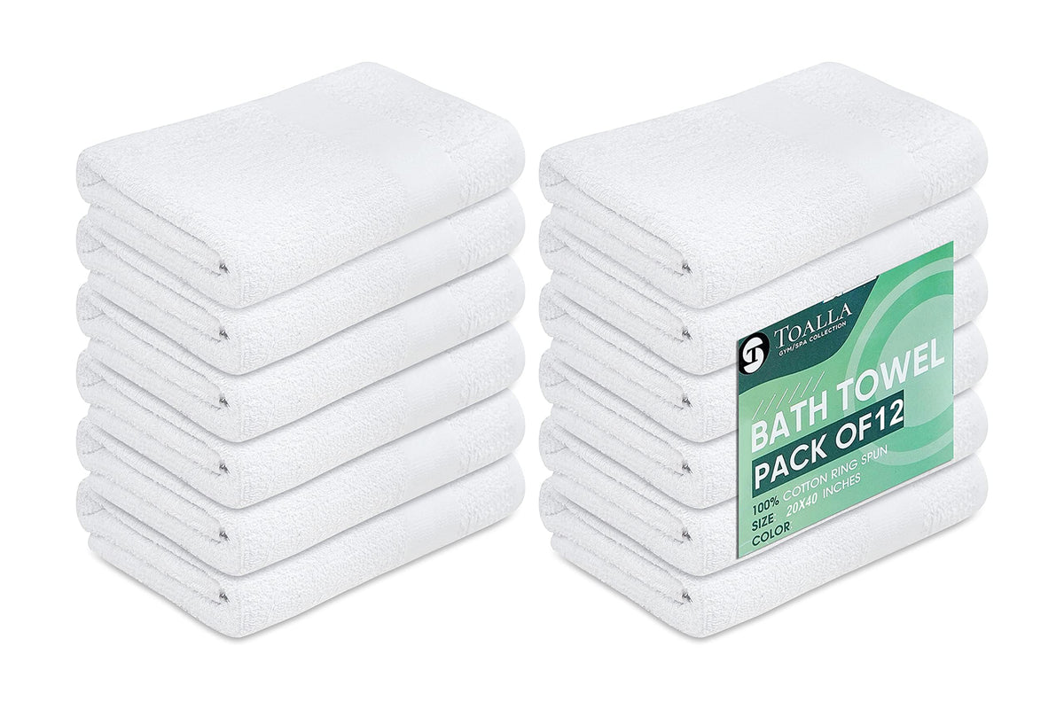 TOALLA white bath towels folded, highlighting plush softness for hotel-quality comfort.