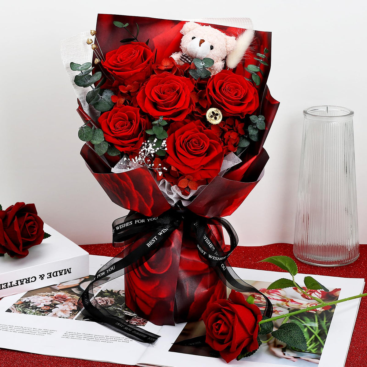 Tobilu preserved arrangement includes eucalyptus leaves and rabbit ears detail for natural charm.